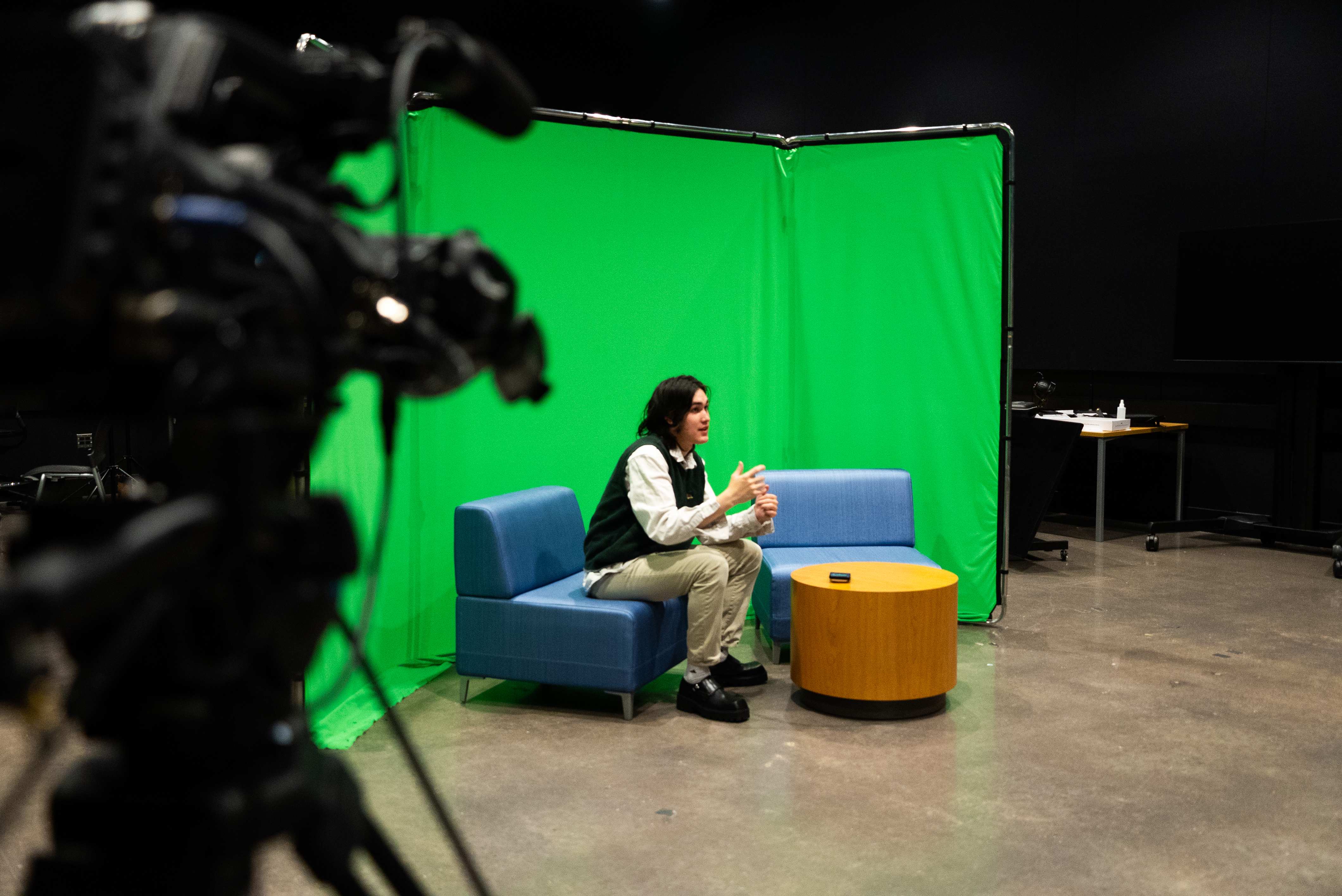 Interview being filmed on a green-screen set